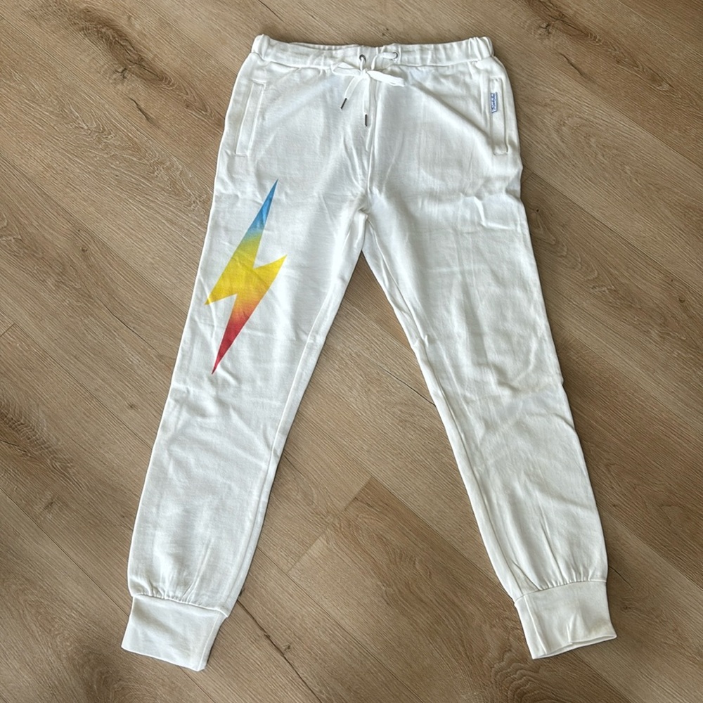 white sweats with colored lightning bolt